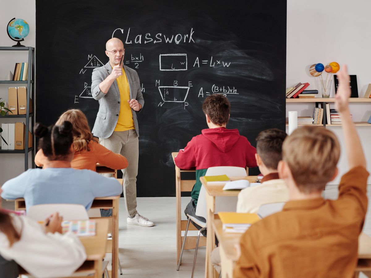Teacher and students in a middle school classroom
